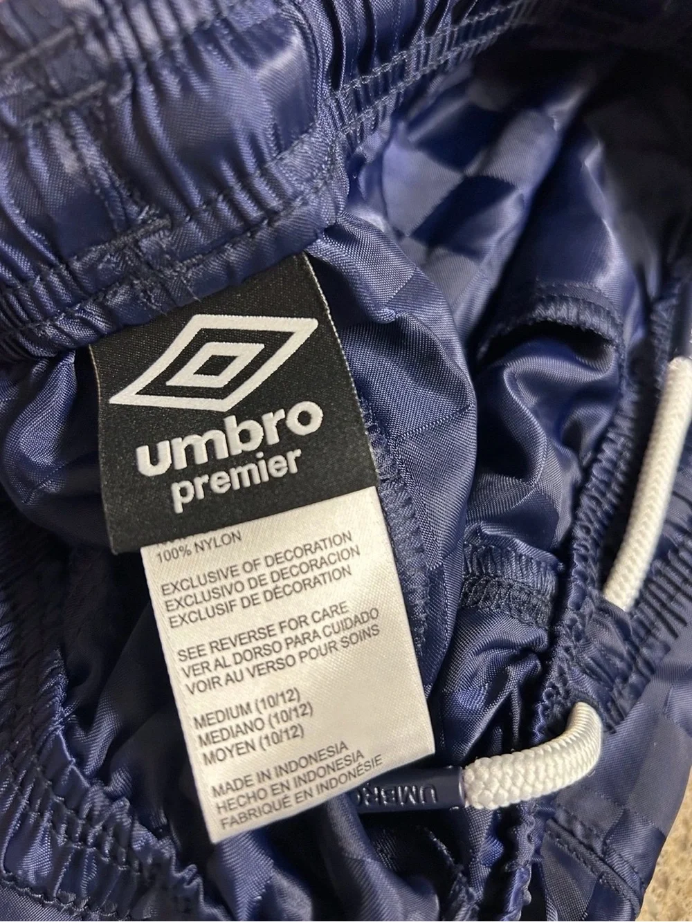 BUNDLE of 4 Umbro boys' athletic  shorts with a embossed retro checkered pattern
